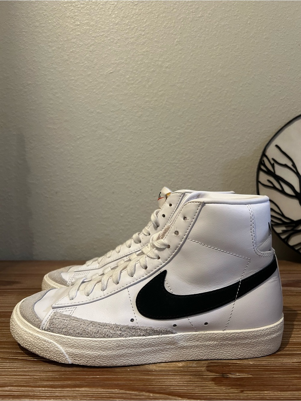 Nike White High-Top Sneakers with Black Swoosh
